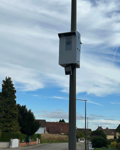 City surveillance light on a post in France